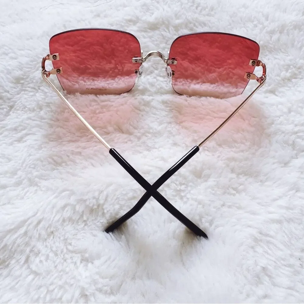 Laurel Clear Orange Rimless Sleek Sunglasses
